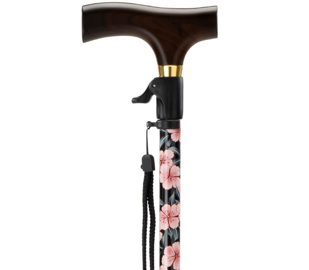 MultiMotion wandelstok met drukknop bediening - Bloemen (ingezoomd op het handvat en de drukknop bediening) MultiMotion wandelstok met drukknop bediening - Bloemen (ingezoomd op het handvat en de drukknop bediening)