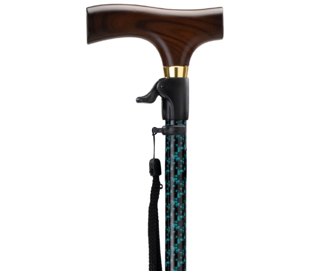 MultiMotion wandelstok met drukknop bediening - Zwart/ groene print (ingezoomd op het handvat met drukknop bediening) MultiMotion wandelstok met drukknop bediening - Zwart/ groene print (ingezoomd op het handvat met drukknop bediening)