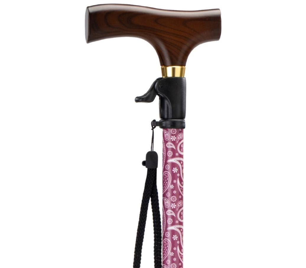 MultiMotion wandelstok met drukknop bediening - Rood paisley (ingezoomd op handvat met drukknop bediening) MultiMotion wandelstok met drukknop bediening - Rood paisley (ingezoomd op handvat met drukknop bediening)